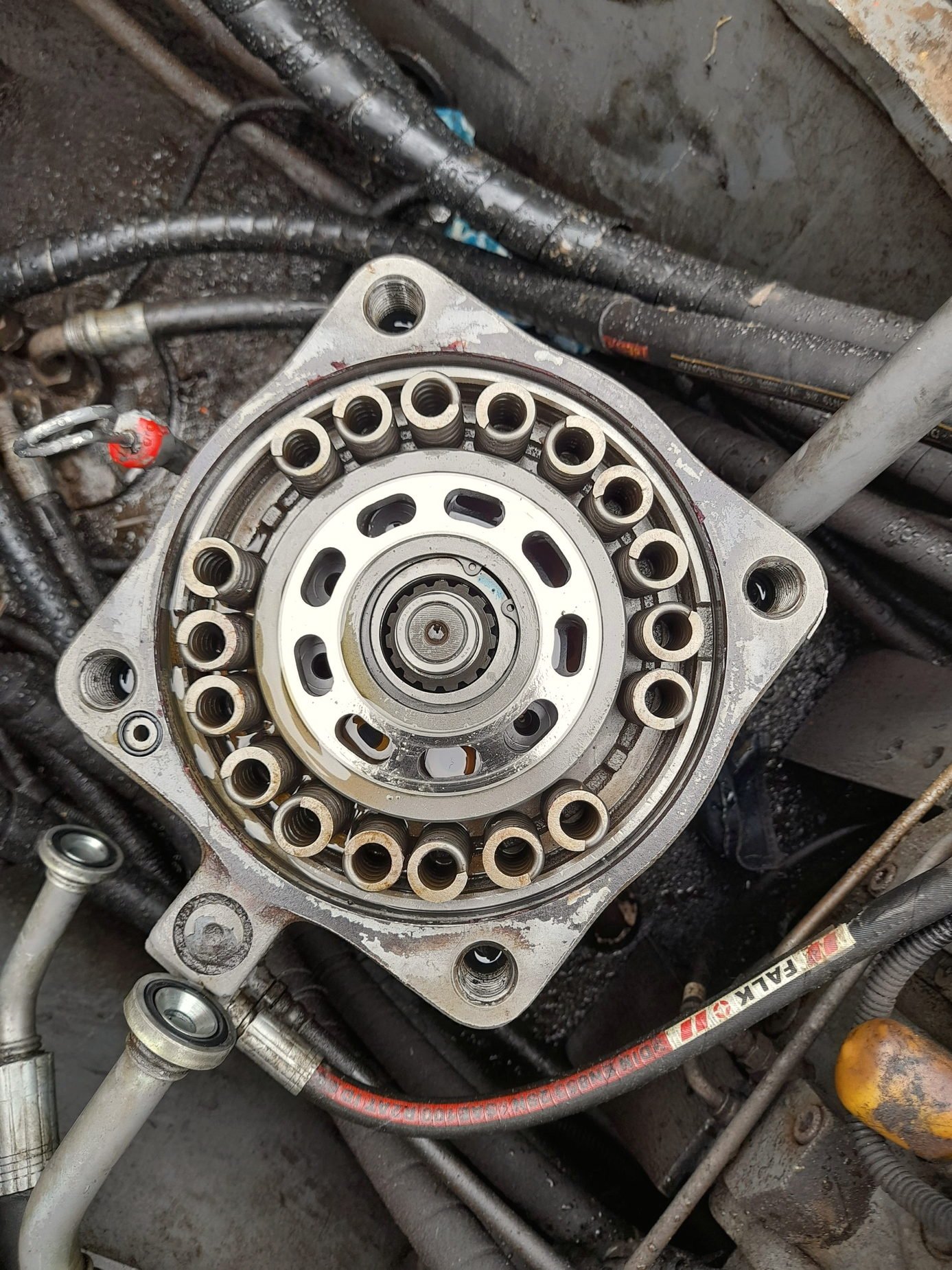 A hydraulic pump housing with its ports and hose connection